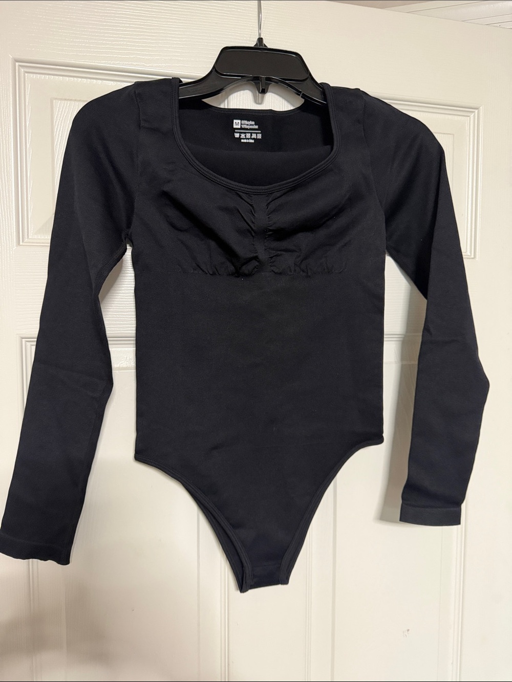 OQQ Woman’s Black Long Sleeve One-Piece Bodysuit